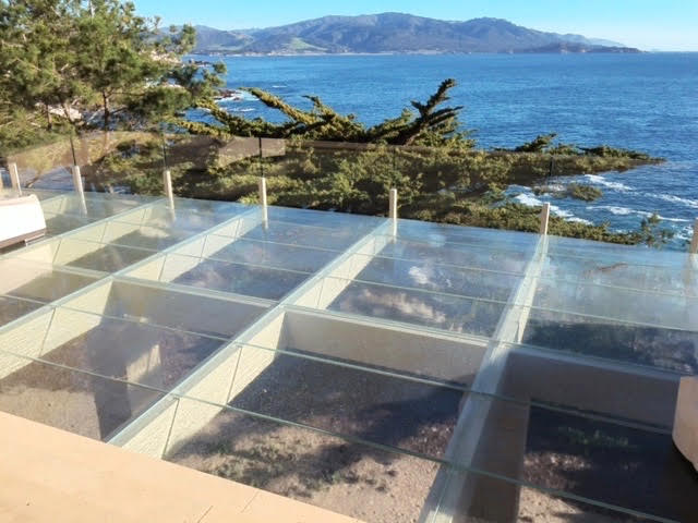 Walkable Skylight from Jockimo Looking Out onto Blue Water and Hills